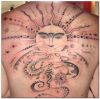 tribal sun back tattoo